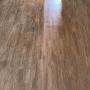 cleaning wooden floor boards in process
