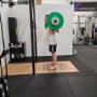 Personal training session hitting the squat rack.