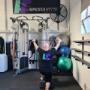Lat pulls down during a personal training session.