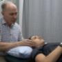 Allan Bourke instructs a patient on TMJ Physio at Penrith Physiotherapy Sports Centre