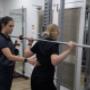Michaela instructs a patient on physio exercises at Penrith Physiotherapy Sports Centre
