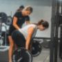 Our personal trainer giving hands on coaching guidance with our clients