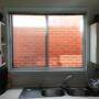 Secondary glazed horizontal slider window in kitchen