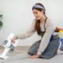 housekeeper-is-using-cordless-vacuum-cleaner-with-2023-05-24-20-35-59-utc