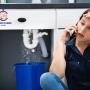 24 hour Plumber Sydney responding to an emergency call from a woman in a residential buidling in Syd