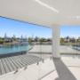 Waterfront balcony with glass balustrade and canal views
