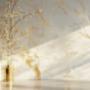 A high-gloss Venetian plaster wall in Sydney with a white base and delicate gold veining throughout
