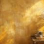 A warm golden-yellow Venetian plaster wall with a slightly textured finish in Sydney