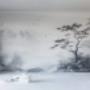 A living room with a decorative mural being painted on one wall