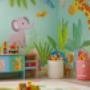 children’s room painted with a pastel color and stenciled patterns of animals and shapes