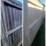 Wood fence pressure washing using soft wash unit