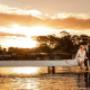 portstephens wedding Bride and Groom kissing whilst having there photos taken as the sunsets  by Thierry Boudan Photography