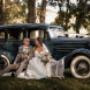 Bride and Groom sit in front of the wedding car taking time away from there wedding at Peterson house Hunter Valley by Thierry Boudan Photography