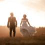 Bride and Groom walking in the sunset taking a break from there wedding at Enzo Hunter Valley by Thierry Boudan Photography