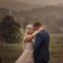 Riverwood downs Bride and Groom kissing in the rain during there wedding day by Thierry Boudan Photography