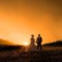 magic sunset in the Hunter Valley bride and groom looking at each other taking a moment away from there wedding  photographed by Thierry Boudan Photography