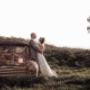 Bride and Groom leaning on rusty old car on there wedding day venue tocal homestead Maitland photographed by Thierry Boudan Photography