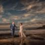 Bride and Groom in Newcastle on wedding day at merewether beach as the sunsets by Thierry Boudan Photography