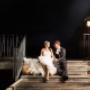 Bride and Groom at caves beach resort wedding venue stairs looking at each other at night by Thierry Boudan Photography