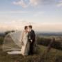 Bride and Groom kissing on top of the mountain at Hunter Valley vineyards but Thierry Boudan Photography