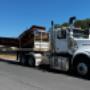 Flat top extendable crane truck