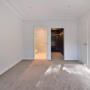 Bedroom with access to ensuite and custom walk-in wardrobe