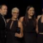 Trish Hammond posing after accepting award in 2015 for best beauty blogger