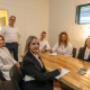 A collaborative strategy meeting at Trekk Advisory Northern Rivers. The full team of accountants and business advisors gathers around a meeting table, sharing ideas and planning together in a relaxed, modern workspace.