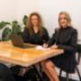 Two Trekk Advisory Northern Rivers team members meet to review notes and client plans in a quiet corner of the office. The interaction highlights a calm, focused environment and their commitment to thoughtful business advice.