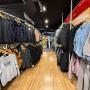 Cherri Pow Snowboard Store & Service Centre Jindabyne's hallway displaying winter clothing and snowboards