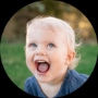 Childcare-SmilingGirl-DarkBlueDress-Circle