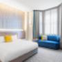 Deluxe King Room with a king bed and work desk