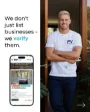 A smiling plumber holding a spanner next to text about verified listings and a mobile directory.